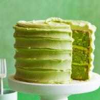 Green cake with slice missing