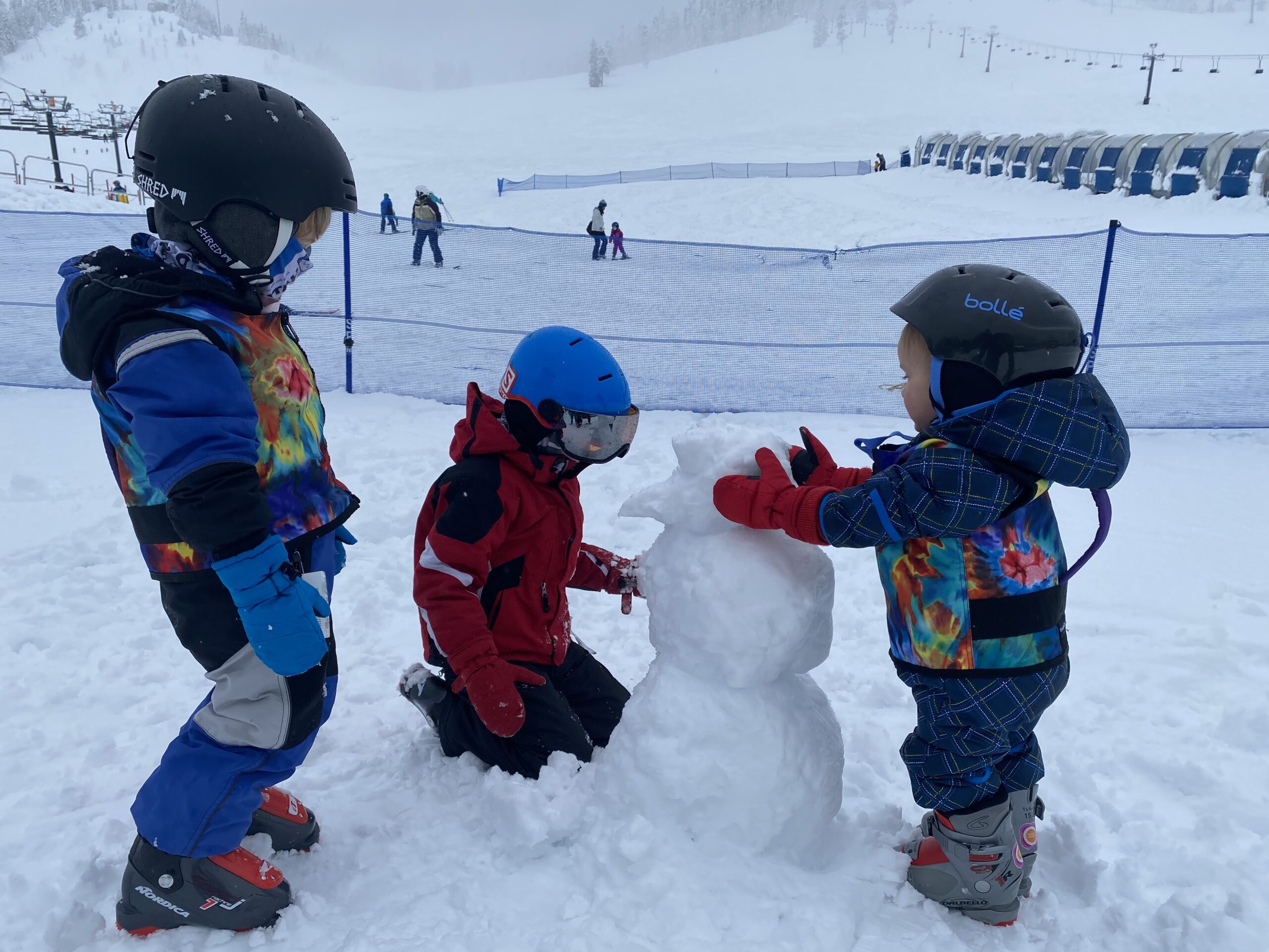 Building a snowman after skiing