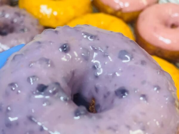 Blueberry glazed donut, lavender colored. 