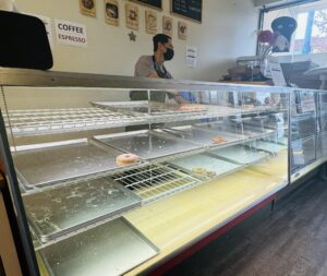 Empty cases in a donut shop. 
