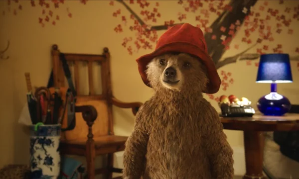 Paddington Bear standing in children's room